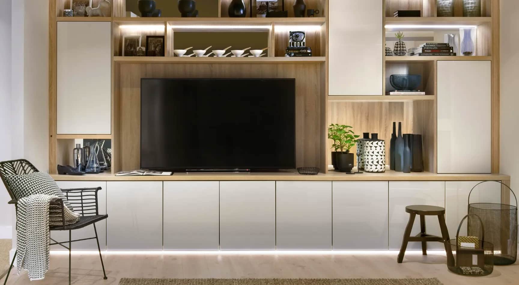 Oak TV unit with white glass doors, open shelving and LED lighting
