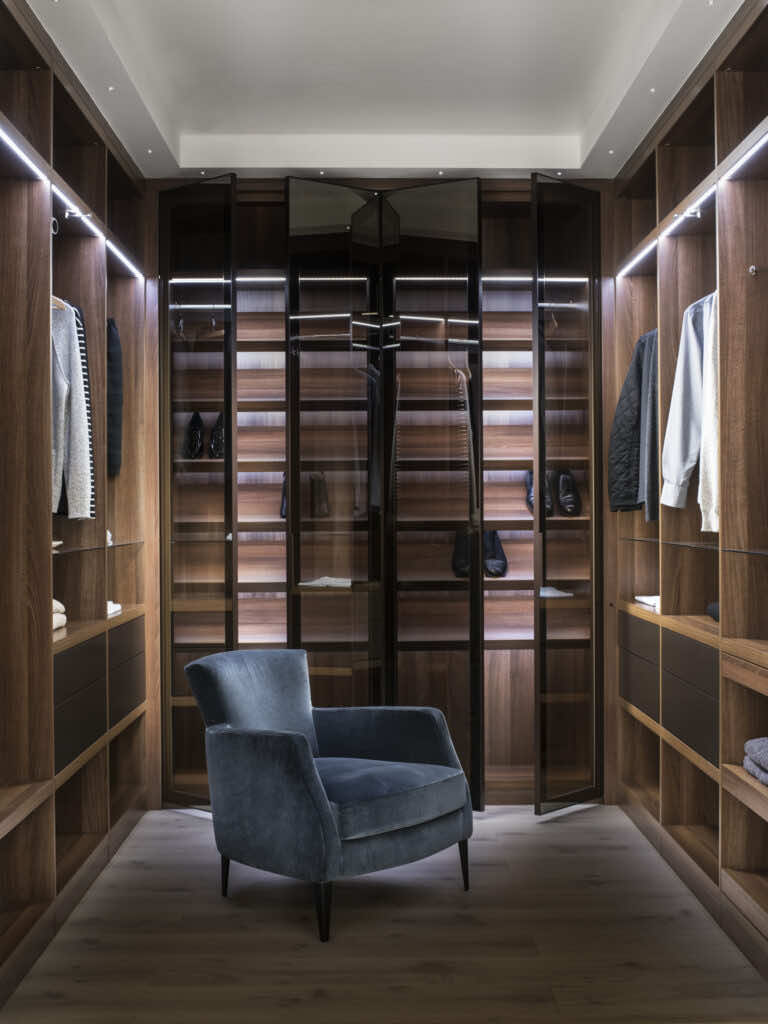 Neatsmith bespoke wardrobes ad with reflex door wardrobes and blue chair